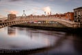 Hapenny Bridge over the Liffey River long exposure at sunset