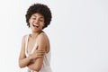 Hapiness comes with good health. Good-looking emotive and tender feminine African American with afro hairstyle in trendy