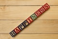 Hapiness wood cube words on wooden table cool Royalty Free Stock Photo