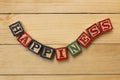 Hapiness wood cube words on wooden table cool Royalty Free Stock Photo