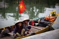 Happy Vietnamese Woman sitting in boat