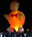 Happening glowing balloons in the night sky