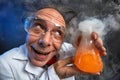 Happily crazy chemist with his experiment Royalty Free Stock Photo