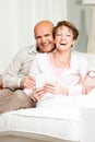 Happily married laughing middle-aged couple