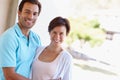 Happily married. Portrait of a loving married couple standing beside each other outside. Royalty Free Stock Photo
