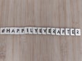 #happilyeverafter happily ever after written on wood blocks on a wood background