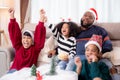 Happiness African family watching movie with excited and fun in the living room for leisure with comfort at home. Royalty Free Stock Photo