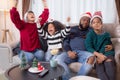 Happiness African family watching movie with excited and fun in the living room for leisure with comfort at home. Royalty Free Stock Photo