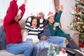 Happiness African family watching movie with excited and fun in the living room for leisure. Royalty Free Stock Photo