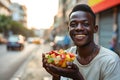 Happiness African Yearold Man Eats Fruit Salad On City Background Royalty Free Stock Photo