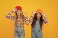 Happiness ahead. Happy small girls enjoying happiness together on yellow background. Little kids with cute smiles Royalty Free Stock Photo