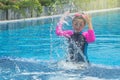 Happiness Asian cute little girl has feeling funny and enjoy in swimming pool.