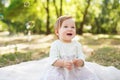 Happiness Baby girls sitting in the park with sunlights Royalty Free Stock Photo