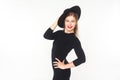 Happiness beautiful woman in hat, black overall posing at camera