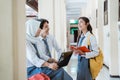 happiness a boy, girl, and girl in a veil in high school uniform using a laptop computer together when discussing Royalty Free Stock Photo