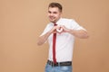 Happiness businessman showing heart shape sign Royalty Free Stock Photo