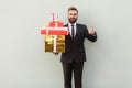 Happiness businessman toothy smile, holding box and thumbs up.