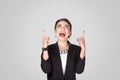 Happiness businesswoman pointing finger up at copy space Royalty Free Stock Photo