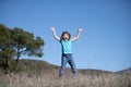 Happiness, childhood, freedom, movement and people concept - happy smiling boy jumping. Royalty Free Stock Photo