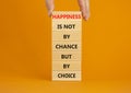 Happiness is choice symbol. Wooden blocks with words Happiness is not by chance but by choice. Beautiful orange background copy Royalty Free Stock Photo