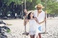 Happiness couple in romantic scene on the beach at sunset. Love and valentine concept