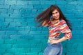 Happiness and craziness. Smiling funny girl have fun outdoor and dances. Young attractive woman with waving long hair Royalty Free Stock Photo