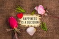 Happiness is a decision written in hole on the burlap