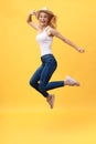 Happiness, dream, fun, joy, summer concept. Very excited happy cute caucasian teen is jumping up, in summer outfit, hat