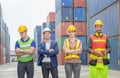 Happiness engineer and worker team standing at container cargo, Success Teamwork Concept Royalty Free Stock Photo