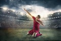 Happiness football player after goal on the field of stadium Royalty Free Stock Photo