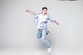 Happiness, freedom, movement and people concept - smiling young man jumping in air isolated on white background Royalty Free Stock Photo