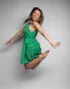 Happiness, freedom and people concept - smiling young woman jump Royalty Free Stock Photo