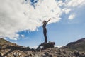 Happiness and freedom people concept - standing woman with backpack and adventure equipment opeing arms enjoying the outdoor Royalty Free Stock Photo