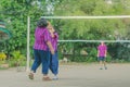 Happiness group of teenage friends playing volleyball