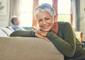 Happiness is her anti-aging remedy. Portrait of a beautiful senior woman relaxing on a couch with her husband in the Royalty Free Stock Photo