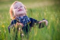 Happiness and joy child expression in a meadow Royalty Free Stock Photo