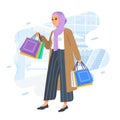 Happiness joyful shopaholic stylish fashionable hijab muslim woman at retail mall store carrying shopping bags