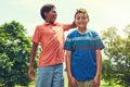 Happiness is making your friends wet with a water balloon. adorable young boys playing with water balloons outdoors. Royalty Free Stock Photo