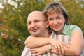 Happiness man and woman in early fall park Royalty Free Stock Photo