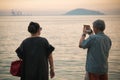 Happiness Mature couple take a photo of sunset