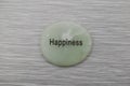 Happiness mood stone on gray background Royalty Free Stock Photo