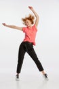 Excited beautiful young redheaded woman dancing isolated on white studio background. Human emotions, facial expression Royalty Free Stock Photo