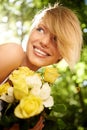 Happiness, nature and woman in garden with flowers for holiday in spring, outdoor fun and adventure. Smile, freedom and