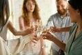 People clinking glasses with wine or champagne. Happy cheerful friends celebrate holidays, meeting. Close up shot of Royalty Free Stock Photo