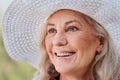 Happiness is permanent on her face. Cropped shot of an attractive senior woman smiling while standing outdoors on a Royalty Free Stock Photo