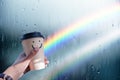Happiness and Positive Mind, Mental Health Concept. Enjoying Coffee with Smiling Face Cartoon, Blurred Rain with Rainbow as