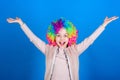 Happiness only real when shared. Happy little girl child wearing bright wig hair smiling with happiness. The child of so Royalty Free Stock Photo