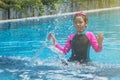 Happiness and smiling Asian cute little girl has feeling funny and enjoy in swimming pool. Royalty Free Stock Photo