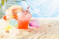 Happiness summer holiday on sunny tropical sea coast under palm with beach games, fresh fruit cold drink and sun hat. Vacation.