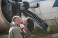 Happiness is traveling. woman and handsome man enjoy summer romance. Couple in love kiss at airplane. Loving couple